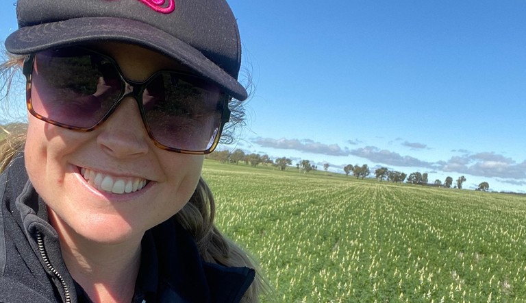 Agronomist Ashlyn Ridgway looking at Ultro herbicide in lupins