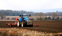 Tractor plouging a field