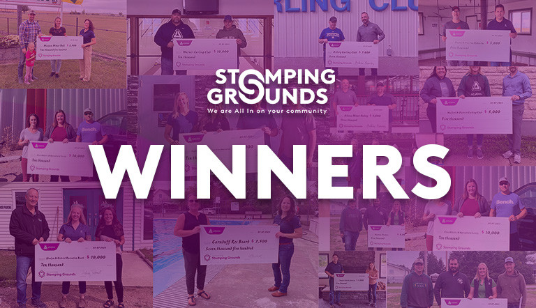 Stomping Grounds recipients holding cheques 