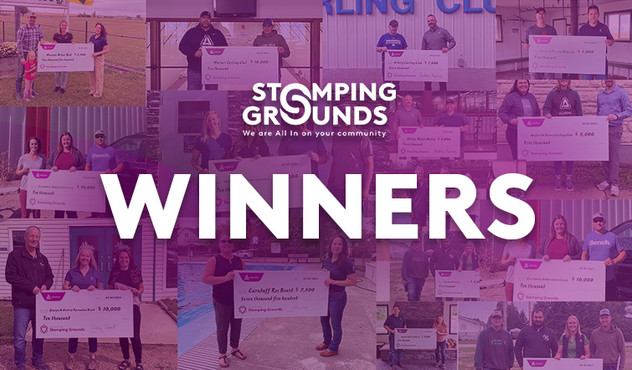 Stomping Grounds recipients holding cheques 